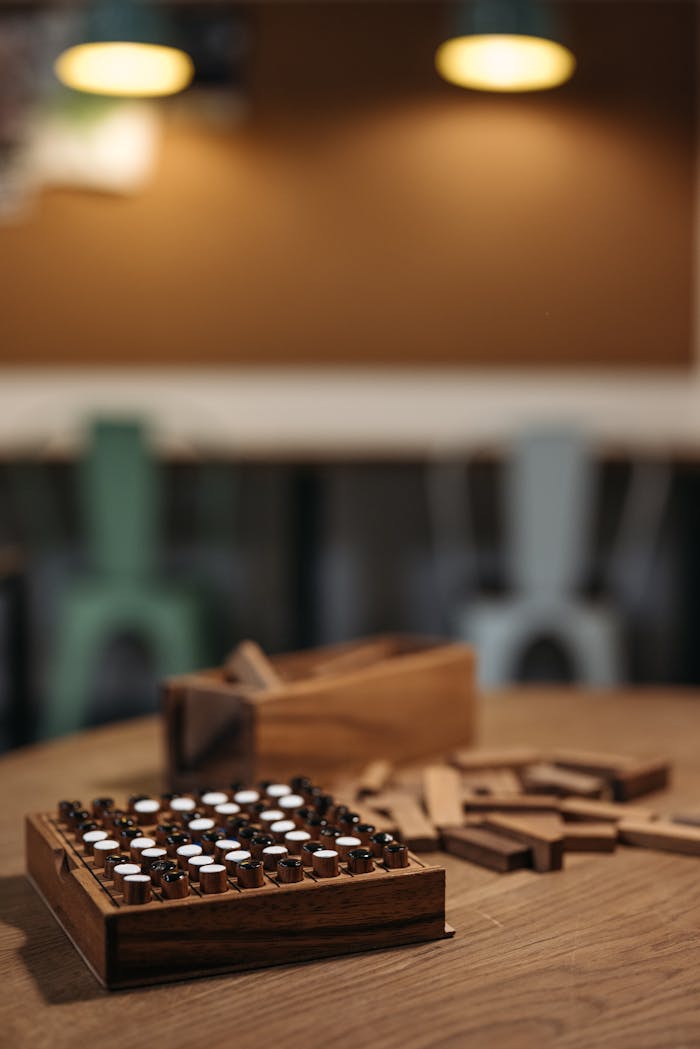 Close-up of a wooden board game on a table with a warm, cozy atmosphere.